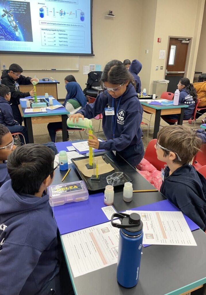 Student using a graduated cylinder.